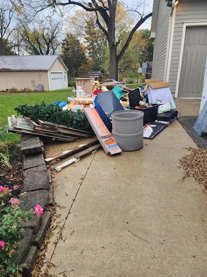 Dumpster being loaded with debris for Estate Cleanout Dumpster Rental in Hutchinson Island South